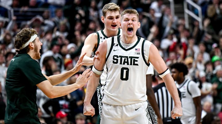 Michigan State's Jaxon Kohler, right, celebrates with teammates Carson Cooper, center, and Gehrig Normand, left