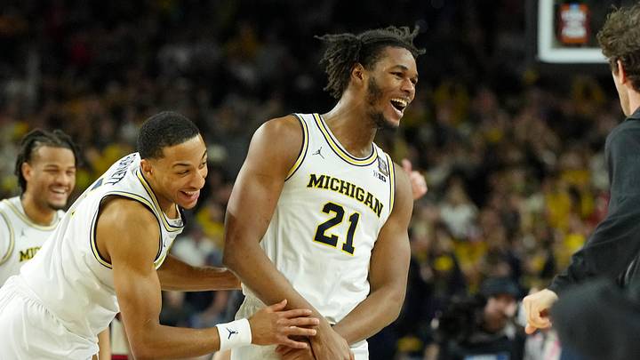 Apr 6, 2026; Indianapolis, IN, USA; Michigan Wolverines forward Morez Johnson Jr. (21) and guard Nimari Burnett (4) celebrate after their win against the UConn Huskies in the national championship of the Final Four of the men's 2026 NCAA Tournament between the and the Michigan Wolverines at Lucas Oil Stadium. Apr 6, 2026; Indianapolis, IN, USA; Michigan Wolverines forward Morez Johnson Jr. (21) and guard Nimari Burnett (4) celebrate after their win against the UConn Huskies in the national championship of the Final Four of the men's 2026 NCAA Tournament between the and the Michigan Wolverines at Lucas Oil Stadium.