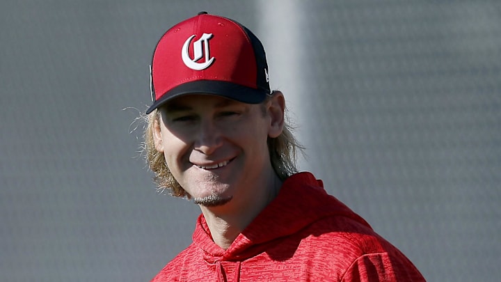 Former Cincinnati Reds pitcher Bronson Arroyo helps out during warmups.
