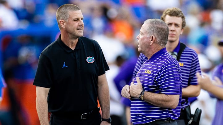 Florida Gators head coach Billy Napier and LSU Tigers head coach Brian Kelly talk before the game at Steve Spurrier Field at Ben Hill Griffin Stadium in Gainesville, FL on Saturday, October 15, 2022. [Matt Pendleton/Gainesville Sun]