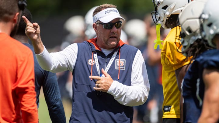 Auburn Tigers head coach Hugh Freeze talks with wide receiver Cam Coleman (8) during practice at Woltosz Football Performance Center in Auburn, Ala. on Thursday, Aug. 14, 2025.