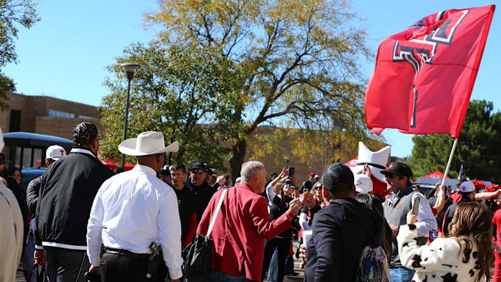 Nov 9, 2024; Lubbock, Texas, USA; Texas Tech Red Raiders head coach Joey McGuire greets fans before the game against the Colorado Buffalos at Jones AT&T Stadium and Cody Campbell Field. Mandatory Credit: Michael C. Johnson-Imagn Images