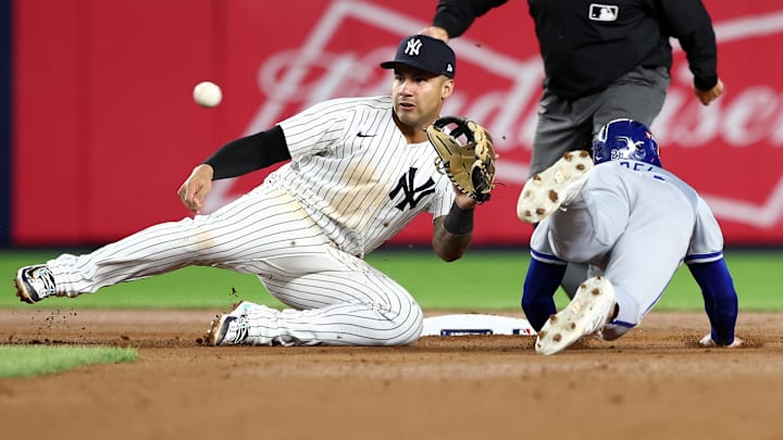 Oct 7, 2024; Bronx, New York, USA; New York Yankees second base Gleyber Torres (25) gets the tag on Kansas City Royals outfielder Kyle Isbel (28) attempting to steal second base in the seventh inning during game two of the ALDS for the 2024 MLB Playoffs at Yankee Stadium. Mandatory Credit: Vincent Carchietta-Imagn Images Oct 7, 2024; Bronx, New York, USA; New York Yankees second base Gleyber Torres (25) gets the tag on Kansas City Royals outfielder Kyle Isbel (28) attempting to steal second base in the seventh inning during game two of the ALDS for the 2024 MLB Playoffs at Yankee Stadium. Mandatory Credit: Vincent Carchietta-Imagn Images
