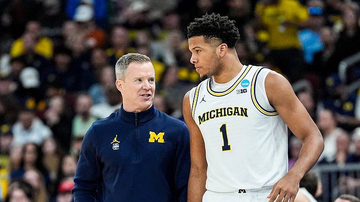Michigan head coach Dusty May talks to guard Trey McKenney (1) before a play against Tennessee during the first half of NCAA Tournament Elite 8 round at United Center in Chicago on Sunday, March 29, 2026. Michigan head coach Dusty May talks to guard Trey McKenney (1) before a play against Tennessee during the first half of NCAA Tournament Elite 8 round at United Center in Chicago on Sunday, March 29, 2026.