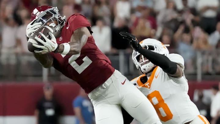 Oct 18, 2025; Tuscaloosa, Alabama, USA; Alabama Crimson Tide wide receiver Ryan Williams (2) makes a catch while being defended by Tennessee Volunteers defensive back Colton Hood (8) at Saban Field at Bryant-Denny Stadium. Mandatory Credit: Gary Cosby-USA TODAY Network via Imagn Images
