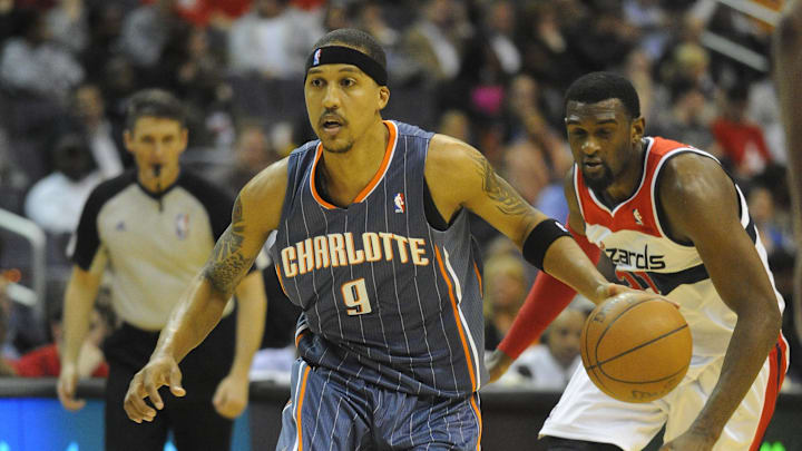 Apr 23, 2012; Washington, DC, USA; Charlotte Bobcats small forward Jamario Moon (9) dribbles past Washington Wizards small forward Chris Singleton (31) during the second half at the Verizon Center. The Wizards defeated the Bobcats 101 - 73. Mandatory Credit: Brad Mills-Imagn Images