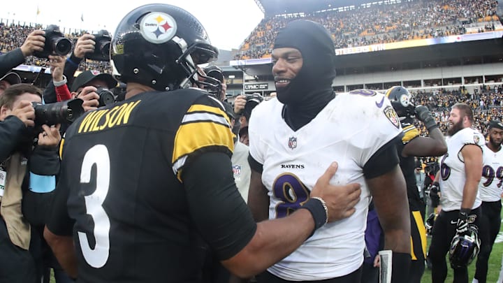 Pittsburgh Steelers quarterback Russell Wilson and Baltimore Ravens quarterback Lamar Jackson meet at mid-field.