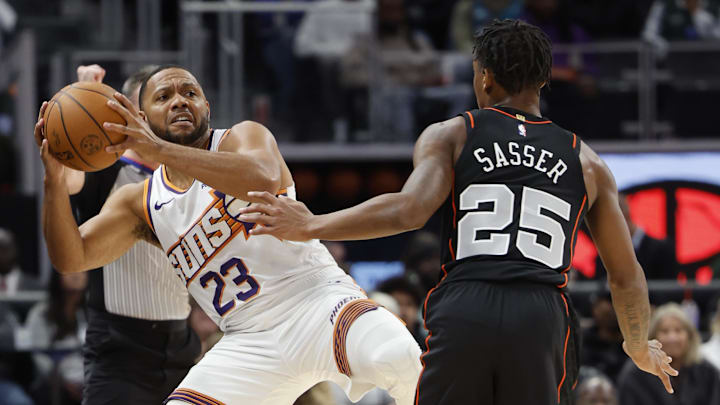 Nov 5, 2023; Detroit, Michigan, USA;  Phoenix Suns guard Eric Gordon (23) is fouled by Detroit Pistons guard Marcus Sasser (25) in the first half at Little Caesars Arena. Mandatory Credit: Rick Osentoski-USA TODAY Sports