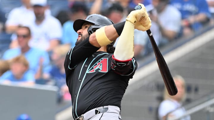 Jun 19, 2025; Toronto, Ontario, CAN;  Arizona Diamondbacks third baseman Eugenio Suarez (28) hits a two run home run against the Toronto Blue Jays in the second inning at Rogers Centre. Mandatory Credit: Dan Hamilton-Imagn Images