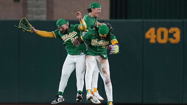 Apr 29, 2026; West Sacramento, California, USA; Athletics left fielder Carlos Cortes (26), center fielder Zack Gelof (20), and right fielder Lawrence Butler (4) celebrate after the Athletics defeated the Kansas City Royals at Sutter Health Park. Mandatory Credit: Cary Edmondson-Imagn Images