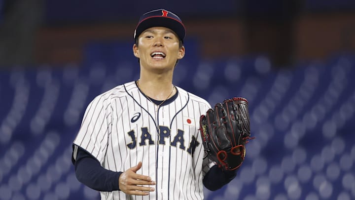 Aug 4, 2021; Yokohama, Japan; Team Japan pitcher Yoshinobu Yamamoto (17) reacts against Korea in a