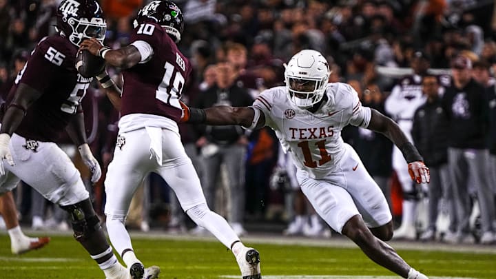 Nov 30, 2024; College Station, Texas, USA; Texas Longhorns edge rusher Colin Simmons (11) pressures Texas A&M quarterback Marcel Reed (10) during the Lone Star Showdown at Kyle Field. Mandatory Credit: Sara Diggins/USA TODAY Network via Imagn Images