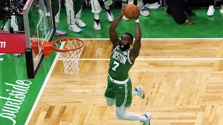 Jun 17, 2024; Boston, Massachusetts, USA; Boston Celtics guard Jaylen Brown (7) dunks against the Dallas Mavericks during the first half in game five of the 2024 NBA Finals at TD Garden. Mandatory Credit: Peter Casey-Imagn Images