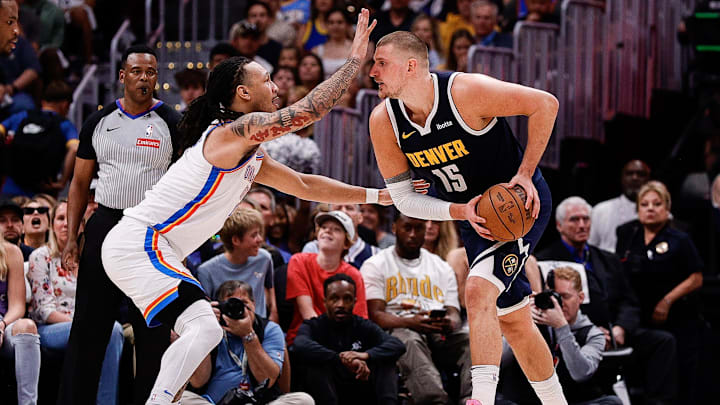 May 11, 2025; Denver, Colorado, USA; Denver Nuggets center Nikola Jokic (15) controls the ball under pressure from Oklahoma City Thunder forward Jaylin Williams (6) in the second quarter during game four of the second round of the 2025 NBA Playoffs at Ball Arena. Mandatory Credit: Isaiah J. Downing-Imagn Images