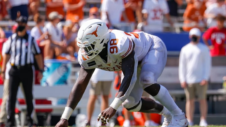 Oct 10, 2020; Dallas, Texas, USA; Texas Longhorns defensive lineman Moro Ojomo (98) lines up against the Oklahoma Sooners during the Red River Showdown at Cotton Bowl. Mandatory Credit: Andrew Dieb-Imagn Images