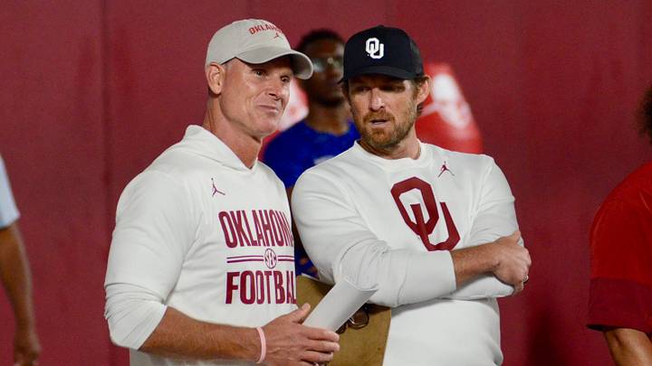 Oklahoma coach Brent Venables and general manager Jim Nagy talk during one of the Sooners' elite prospect camps.