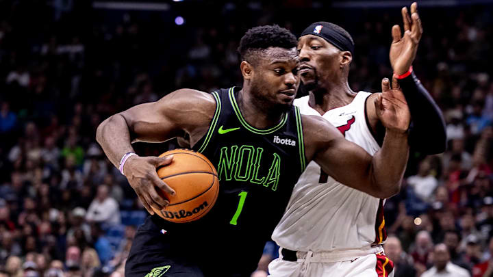 Feb 23, 2024; New Orleans, Louisiana, USA;  New Orleans Pelicans forward Zion Williamson (1) drives to the basket against Miami Heat center Bam Adebayo (13) during the second half at Smoothie King Center. Mandatory Credit: Stephen Lew-Imagn Images