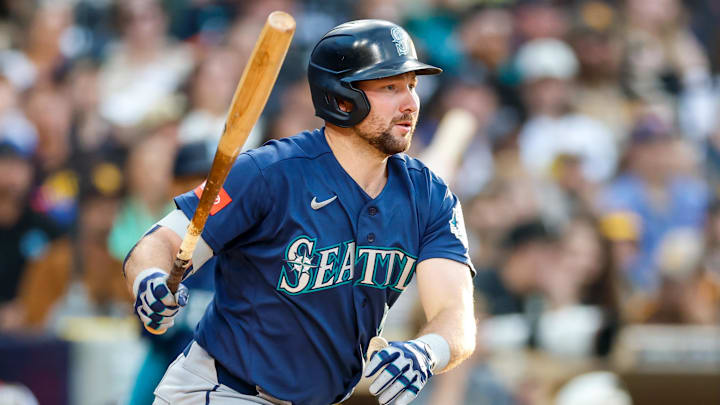 Apr 16, 2026; San Diego, California, USA; Seattle Mariners catcher Cal Raleigh (29) hits a single during the fourth inning against the San Diego Padres at Petco Park. Mandatory Credit: David Frerker-Imagn Images