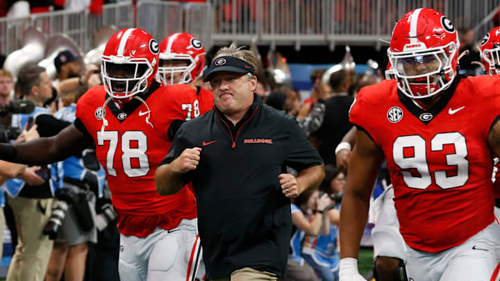 Georgia coach Kirby Smart leads his team onto the field before the start of the NCAA Aflac Kickoff Game in Atlanta, on Saturday, Aug. 31, 2024.