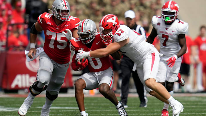 Sep 09, 2023; Columbus, OH, USA; Ohio State Buckeyes wide receiver Xavier Johnson (0) protects the ball