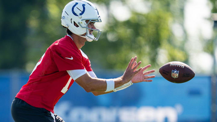 Indianapolis Colts quarterback Daniel Jones (17) takes a snap Wednesday, July 23, 2025, during the first day of training camp held at Grand Park in Westfield.