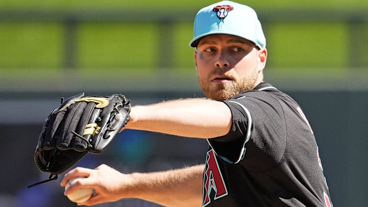 Arizona Diamondbacks pitcher Corbin Burnes warms up before facing the Milwaukee Brewers in the first inning of a spring training game on Feb. 26, 2025, in Scottsdale at Salt River Fields at Talking Stick. Arizona Diamondbacks pitcher Corbin Burnes warms up before facing the Milwaukee Brewers in the first inning of a spring training game on Feb. 26, 2025, in Scottsdale at Salt River Fields at Talking Stick.