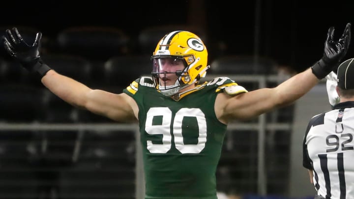 The Green Bay Packers' Lukas Van Ness (90) reacts against the Dallas Cowboys during the fourth quarter of their wild card playoff game Sunday, January 14, in Arlington, Texas. 