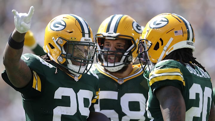 Green Bay Packers safety Xavier McKinney (29) celebrates with Isaiah McDuffie and Javon Bullard after intercepting a pass against Indianapolis Colts.