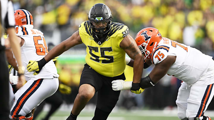 Oct 26, 2024; Eugene, Oregon, USA; Oregon Ducks defensive lineman Derrick Harmon (55) breaks past Illinois Fighting Illini offensive lineman Brandon Henderson (75) during the second half at Autzen Stadium. Mandatory Credit: Troy Wayrynen-Imagn Images Oct 26, 2024; Eugene, Oregon, USA; Oregon Ducks defensive lineman Derrick Harmon (55) breaks past Illinois Fighting Illini offensive lineman Brandon Henderson (75) during the second half at Autzen Stadium. Mandatory Credit: Troy Wayrynen-Imagn Images