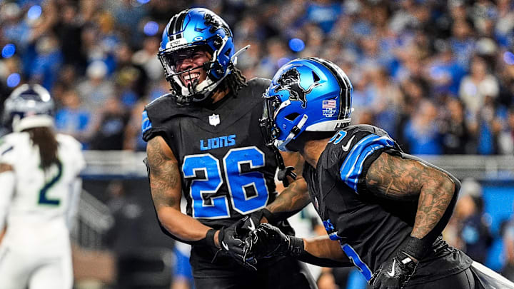 Detroit Lions running back Jahmyr Gibbs (26) celebrates a touchdown against Seattle Seahawks with running back David Montgomery. Detroit Lions running back Jahmyr Gibbs (26) celebrates a touchdown against Seattle Seahawks with running back David Montgomery.