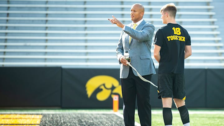 Iowa special teams coordinator LeVar Woods, left, talks with Iowa placekicker Drew Stevens before a NCAA football game against Nevada, Saturday, Sept. 17, 2022, at Kinnick Stadium in Iowa City, Iowa.