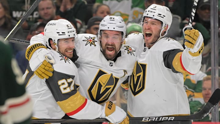 May 1, 2025; Saint Paul, Minnesota, USA;  Vegas Golden Knights forward Mark Stone (61) celebrates his goal against the Minnesota Wild with defenseman Brayden McNabb (3) and defenseman Shea Theodore (27) during the third period in game six of the first round of the 2025 Stanley Cup Playoffs at Xcel Energy Center. Mandatory Credit: Nick Wosika-Imagn Images