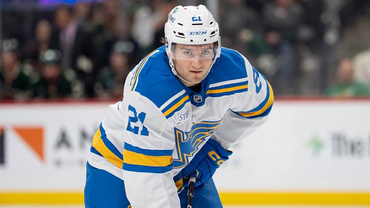Oct 15, 2026; Saint Paul, Minnesota, USA;  St. Louis Blues right wing Jimmy Snuggerud (21) sets up for the face-off against the Minnesota Wild in the third period at Grand Casino Arena.  Mandatory Credit: Matt Blewett-Imagn Images