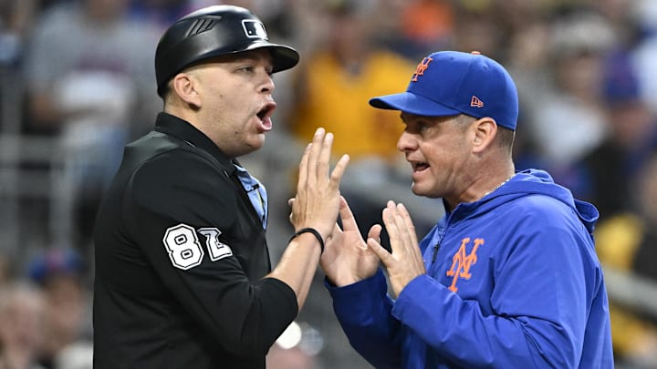 Jul 28, 2025; San Diego, California, USA; New York Mets manager Carlos Mendoza (64) argues with umpire Emil Jimenez (82) after a called strike out during the third inning against the San Diego Padres at Petco Park. 