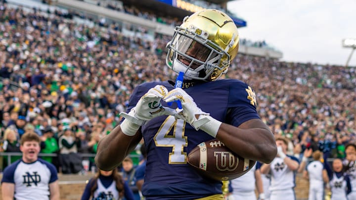 Notre Dame Fighting Irish running back Jeremiyah Love (4) celebrates scoring against the Syracuse Orange during the first half at Notre Dame Stadium.