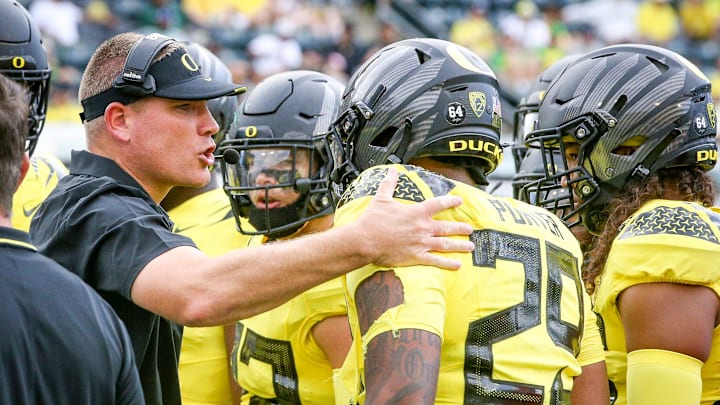 Oregon defensive coordinator Tosh Lupoi rallies the defense as the Oregon Ducks host Portland State in the Ducks season opener Saturday, Sept. 2, 2023, at Autzen Stadium in Eugene, Ore. Oregon defensive coordinator Tosh Lupoi rallies the defense as the Oregon Ducks host Portland State in the Ducks season opener Saturday, Sept. 2, 2023, at Autzen Stadium in Eugene, Ore.