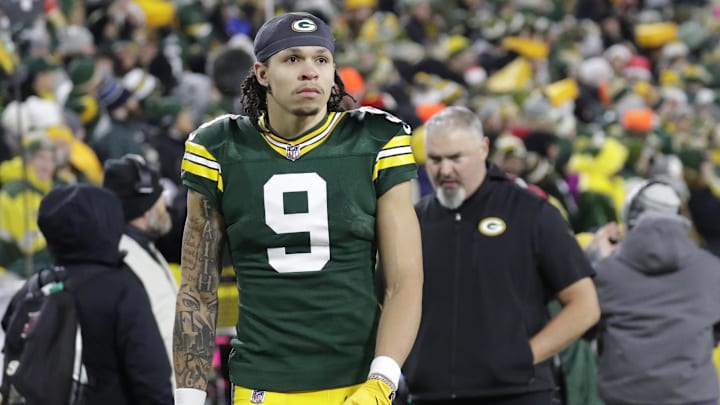 Dec 23, 2024; Green Bay, Wisconsin, USA;  Green Bay Packers wide receiver Christian Watson (9) leaves the field in the fourth quarter after getting injured against the New Orleans Saints at Lambeau Field.