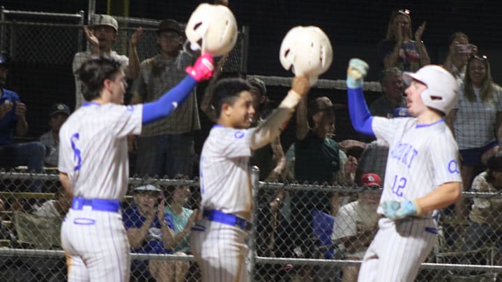 Airport's Rylan Bullis is greeted at homeplate after his 3-run HR. 