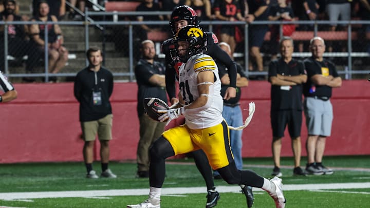 Sep 19, 2025; Piscataway, New Jersey, USA; Iowa Hawkeyes wide receiver Kaden Wetjen (21) returns the opening kickoff for a touchdown during the first quarter against the Rutgers Scarlet Knights at SHI Stadium. Mandatory Credit: Vincent Carchietta-Imagn Images