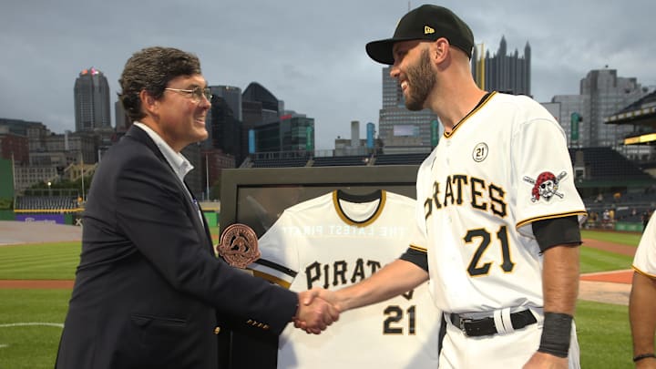 Sep 15, 2021; Pittsburgh, Pennsylvania, USA; Pittsburgh Pirates chairman Robert Nutting (left) presents catcher Jacob Stallings (58) the team Roberto Clemente award before the game against the Cincinnati Reds at PNC Park. Major League Baseball has designated today as Roberto Clemente Day.across the league. Mandatory Credit: Charles LeClaire-Imagn Images Sep 15, 2021; Pittsburgh, Pennsylvania, USA; Pittsburgh Pirates chairman Robert Nutting (left) presents catcher Jacob Stallings (58) the team Roberto Clemente award before the game against the Cincinnati Reds at PNC Park. Major League Baseball has designated today as Roberto Clemente Day.across the league. Mandatory Credit: Charles LeClaire-Imagn Images