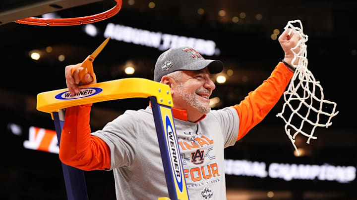 Mar 30, 2025; Atlanta, GA, USA; Auburn Tigers head coach Bruce Pearl celebrates by cutting down the nets after winning the South Regional final of the 2025 NCAA tournament against the Michigan State Spartans at State Farm Arena. Mandatory Credit: Dale Zanine-Imagn Images