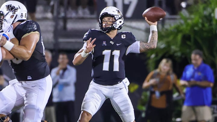 Sep 2, 2021; Orlando, Florida, USA; UCF Knights quarterback Dillon Gabriel (11) passes the ball against the Boise State Broncos during the second quarter at Bounce House. Mandatory Credit: Mike Watters-Imagn Images