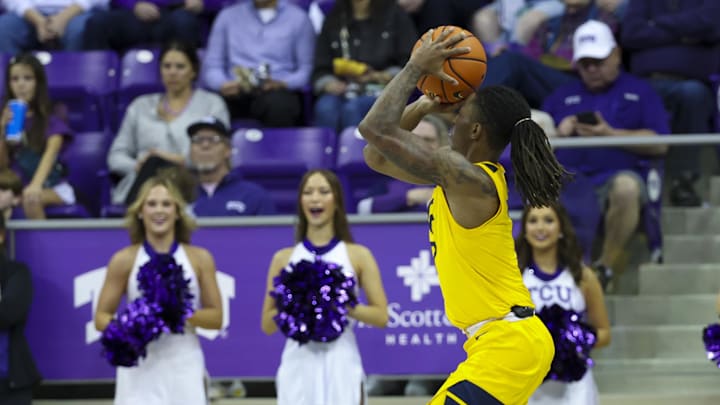 Feb 5, 2025; Fort Worth, Texas, USA; West Virginia Mountaineers guard Javon Small (7) shoots during the first half against the TCU Horned Frogs at Ed and Rae Schollmaier Arena. Feb 5, 2025; Fort Worth, Texas, USA; West Virginia Mountaineers guard Javon Small (7) shoots during the first half against the TCU Horned Frogs at Ed and Rae Schollmaier Arena.