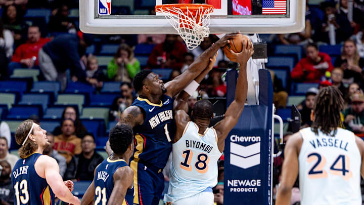 Feb 23, 2025; New Orleans, Louisiana, USA;  New Orleans Pelicans forward Zion Williamson (1) blocks the shot San Antonio Spurs center Bismack Biyombo (18) during the first half at Smoothie King Center. Mandatory Credit: Stephen Lew-Imagn Images