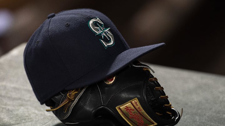 Apr 27, 2015; Arlington, TX, USA; A view of a Seattle Mariners hat and baseball glove during the game between the Texas Rangers and the Mariners at Globe Life Park in Arlington. The Mariners defeated the Rangers 3-1. Mandatory Credit: Jerome Miron-Imagn Images
