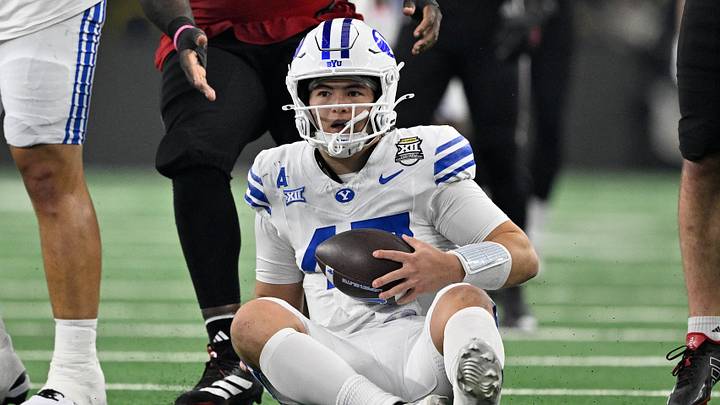 Dec 6, 2025; Arlington, TX, USA; BYU Cougars quarterback Bear Bachmeier (47) sits on the field after recovering the loose ball during the first half against the Texas Tech Red Raiders at AT&T Stadium. Mandatory Credit: Jerome Miron-Imagn Images