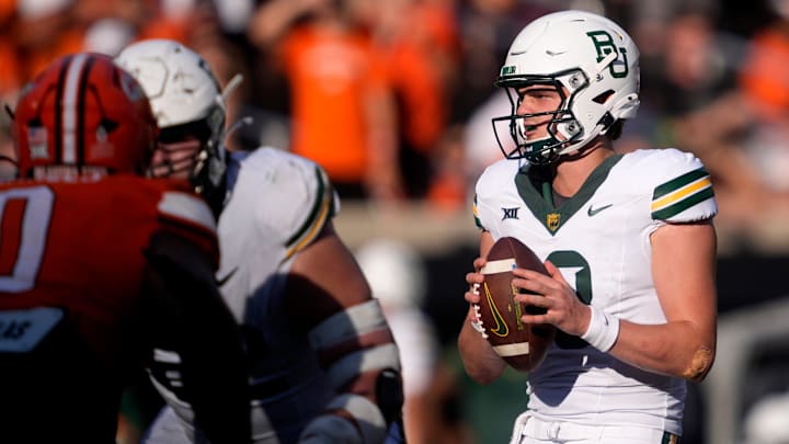Baylor's Sawyer Robertson (13) looks to pass the ball in the second half of the college football game between the Oklahoma State Cowboys and the Baylor Bears at Boone Pickens Stadium in Stillwater, Okla., Saturday, Sept. 27, 2025.