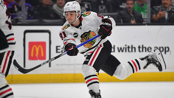 Apr 18, 2024; Los Angeles, California, USA; Chicago Blackhawks center Frank Nazar (91) shoots on goal against the Los Angeles Kings during the first period at Crypto.com Arena. Mandatory Credit: Gary A. Vasquez-Imagn Images