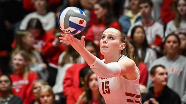 Wisconsin outside hitter Mimi Colyer (15) serves against Marquette in a spring match Wednesday, April 16, 2025, at the UW Field House in Madison, Wisconsin.