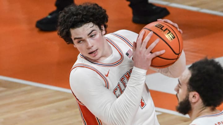 Jan 11, 2025; Clemson, South Carolina, USA; Clemson Tigers forward Ian Schieffelin (4) rebounds against the Florida State Seminoles during the first half at Littlejohn Coliseum.